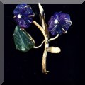 J14. 14K Gold and stone flower brooch. 